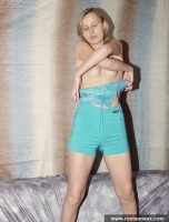 Russian teen blonde takes off dress and poses