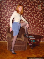 Russian teen redhead in black stockings shows her cute pussy