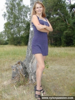Pantyhosed teen girl undressing in the forest