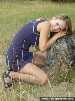 Pantyhosed teen girl undressing in the forest