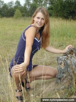 Pantyhosed teen girl undressing in the forest