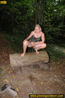 Teen blonde pissing on the forest bench