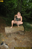 Teen blonde pissing on the forest bench