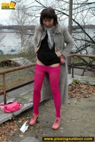 MILF brunette pissing on concrete lookout