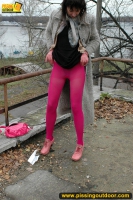 MILF brunette pissing on concrete lookout