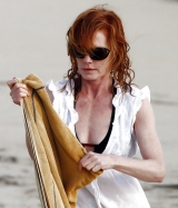 Beautiful Marg Helgenberger wearing black bikini.