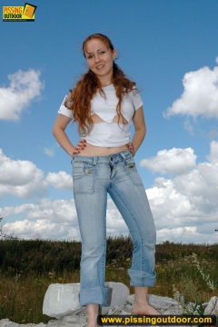 Teeb blonde pisses outdoor on rocks - N