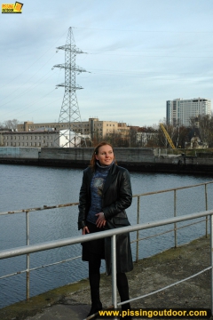 Pissing on the bridge over river - N