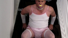 Diapered sissy in choker and chastity - N