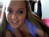 Pupil that is blonde exhibits her large breasts within the