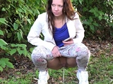 Cute Brunette Babe Squats And Pisses On Grass