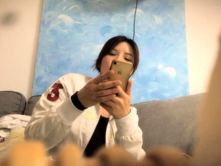 Cute amateur asian web cam girl playing with her toy